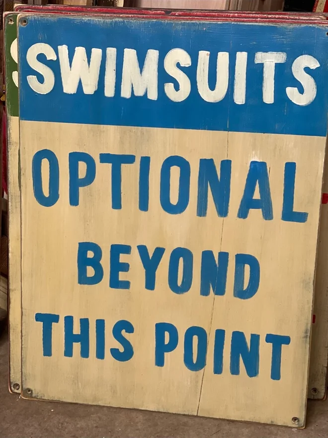 'Swimsuits Optional Beyond This Point' Sign