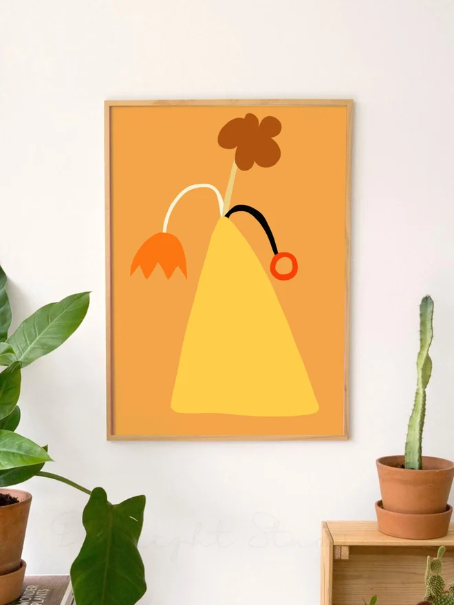 A vase of abstract flowers in a beaut orange pallette.