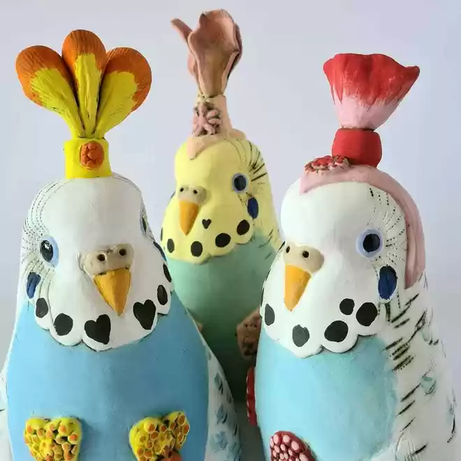 Three ceramic hand-painted birds by Charlotte Miller