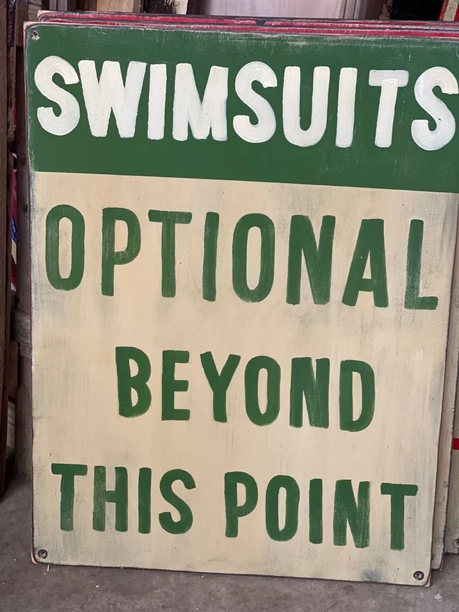 'Swimsuits Optional Beyond This Point' Sign