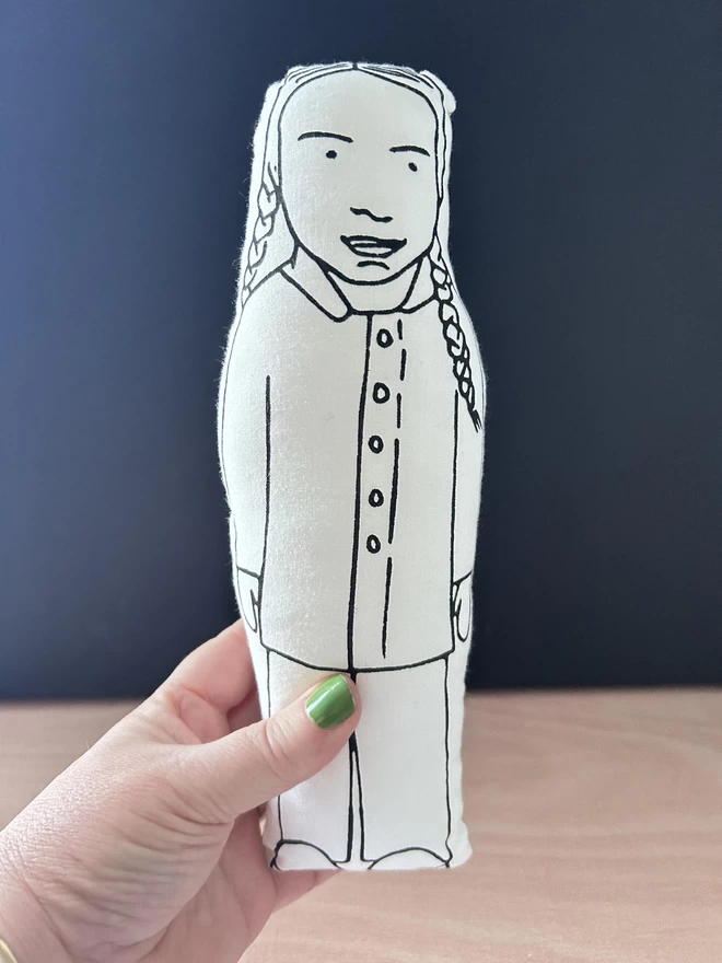 Screen printed fabric doll of Greta Thunberg.