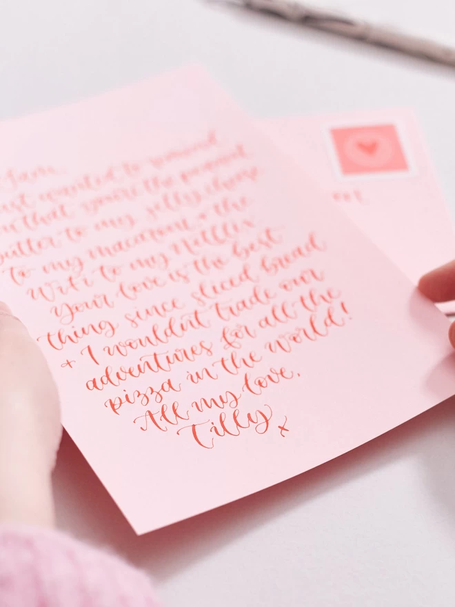 handwritten love letter pink and red calligraphy angle 