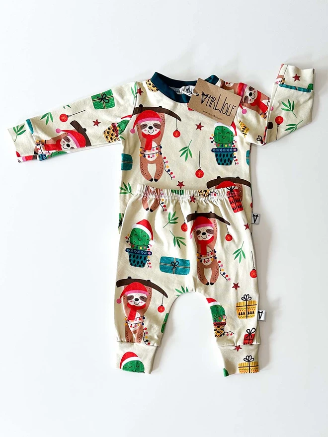 Baby and toddler lounge set with a cute festive sloth print