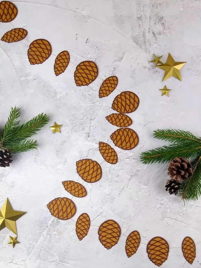 Pinecone Paper Garland showing alternating narrow and wide pinecone decorations