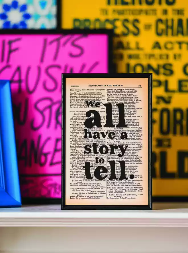 Print that says 'we all have a story to tell' 