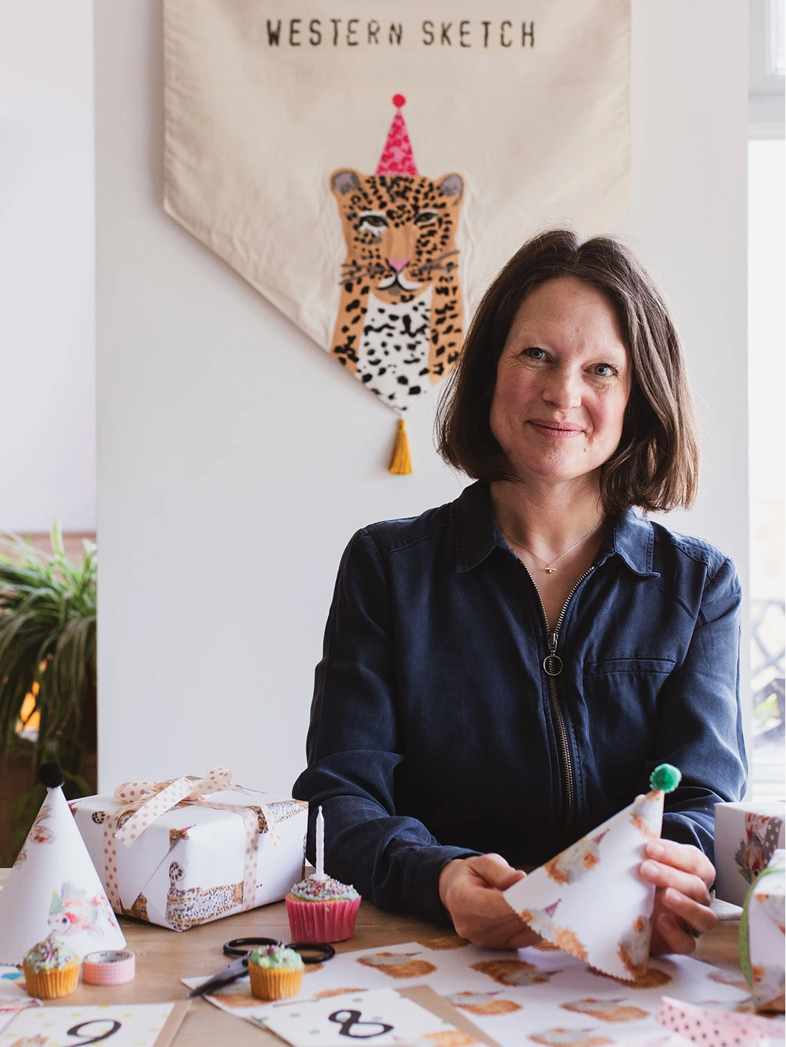 Western Sketch Store Front Photograph of Illustrator Melissa Western sitting in her studio home 