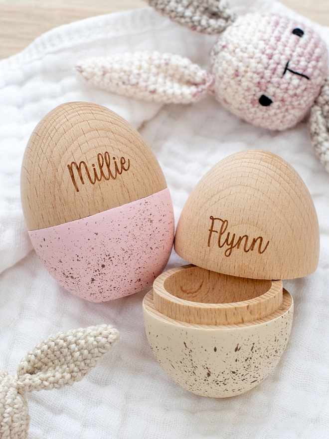 Hollow wooden eggs with speckled finish