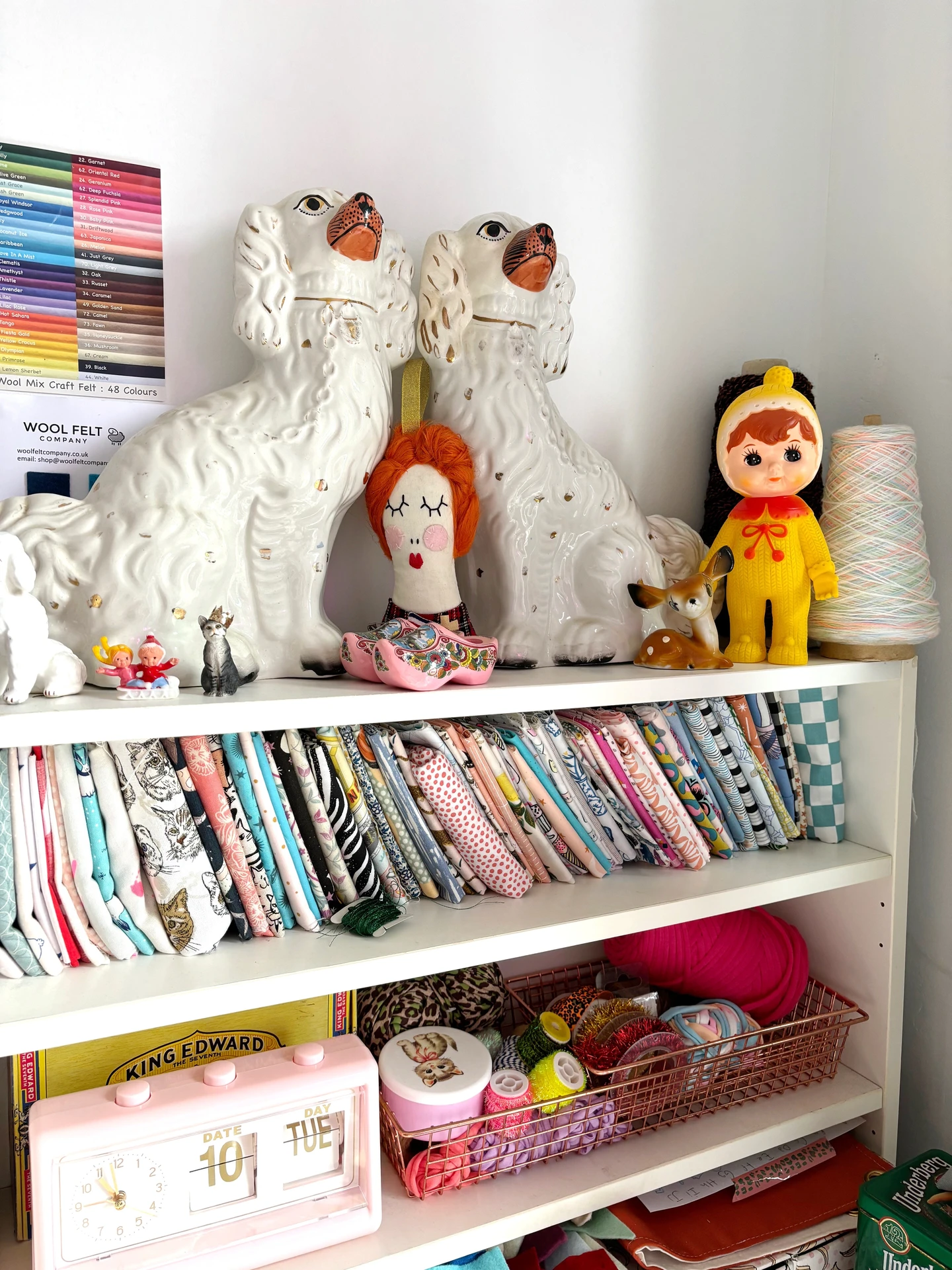 Savana's workspace, shelf with fabric and vintage trinkets