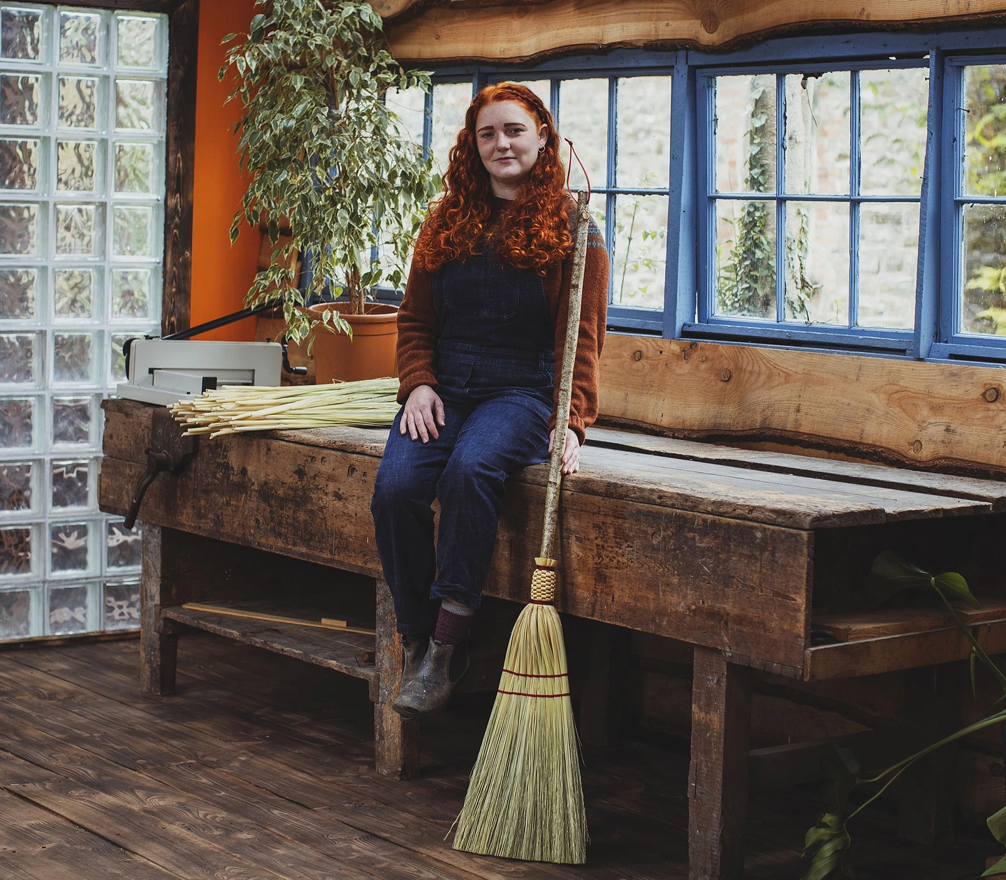Rosa Harradine in her workshop, with a farmhouse broom