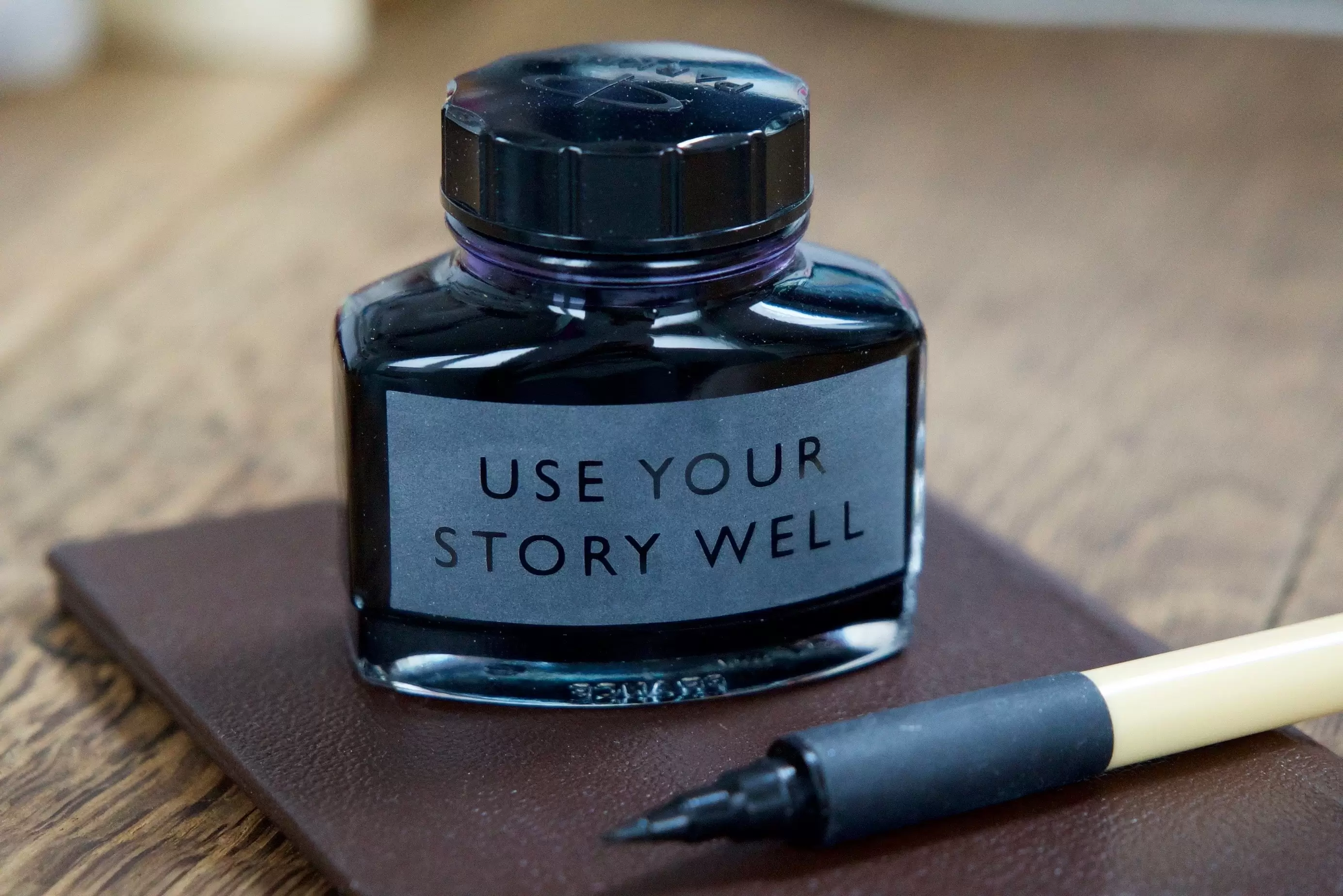 Use your story well ink pot and pen
