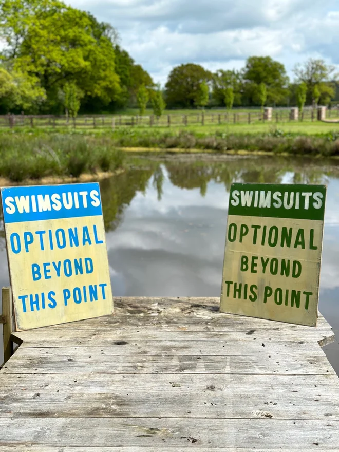 'Swimsuits Optional Beyond This Point' Sign