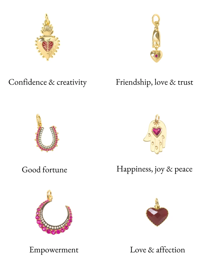 Pink, red and gold charms on a white background