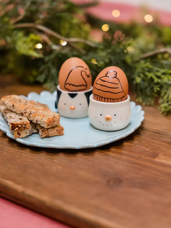 Penguin and snowman egg cups