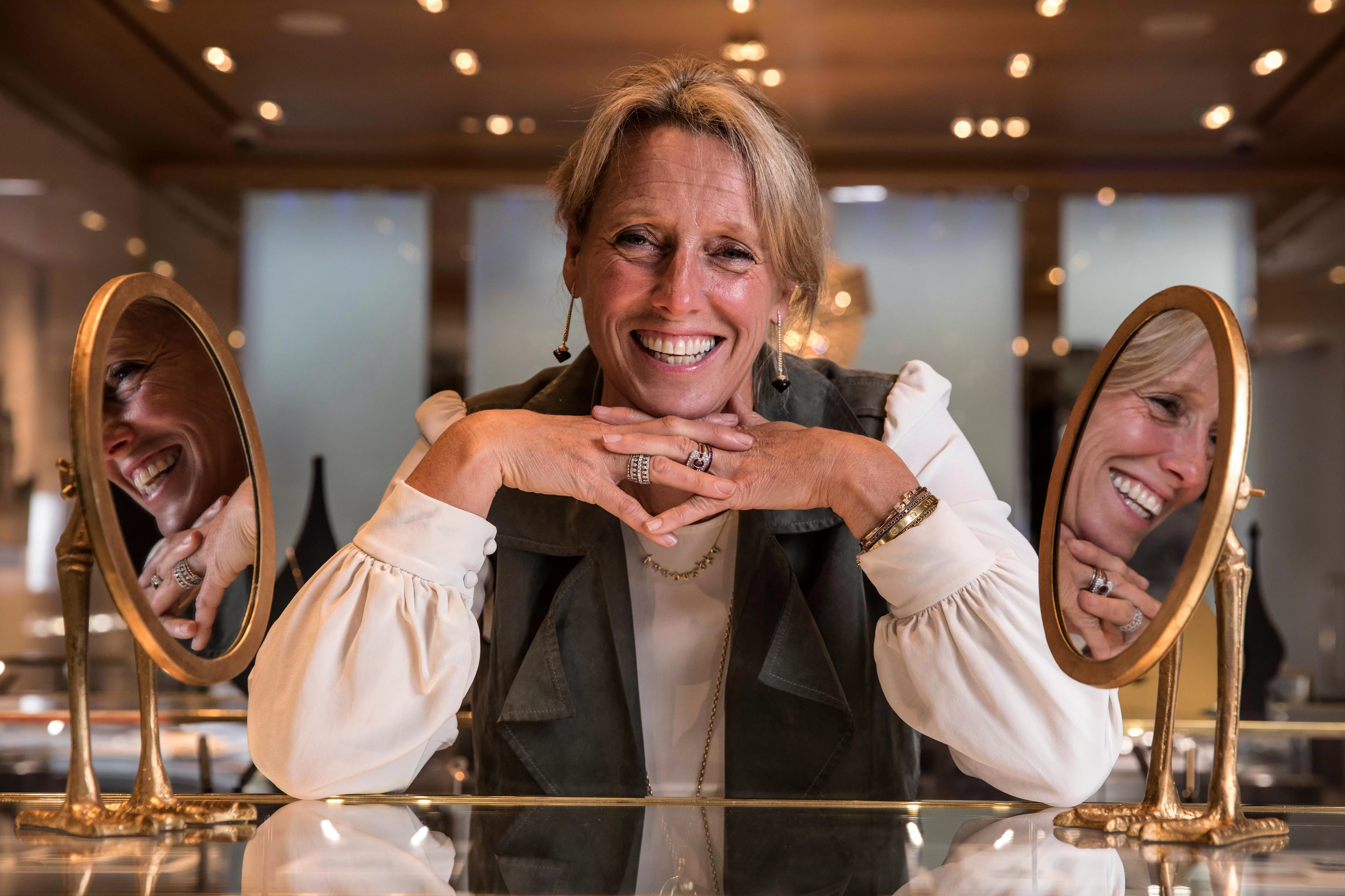 Annoushka Ducas, founder of Links of London and Annoushka Jewellery leaning on one of the shop counters