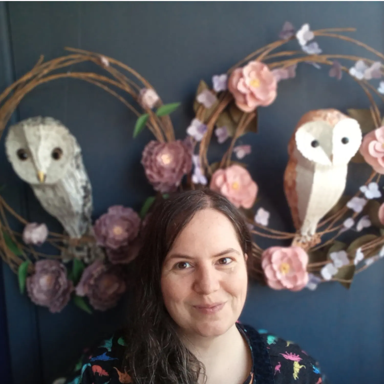 Kaper storefront image, Kate in her studio surrounded by owl paper sculptures