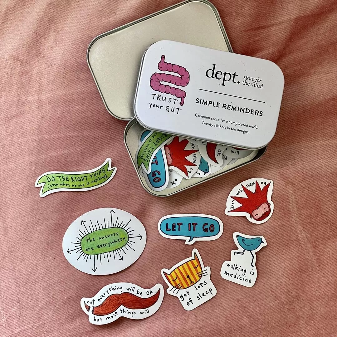 Selection of stickers coming out of a tin 