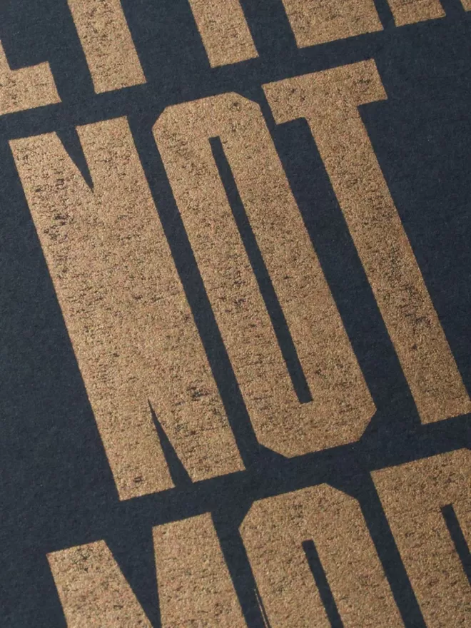 Close Up of Better Not More Black and Gold Linocut