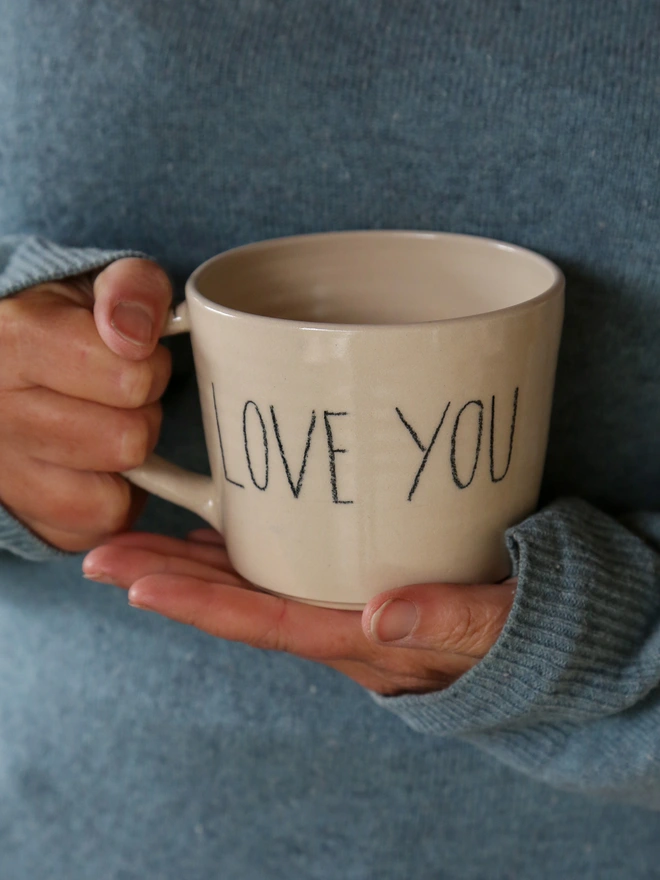 love you text on back of mug