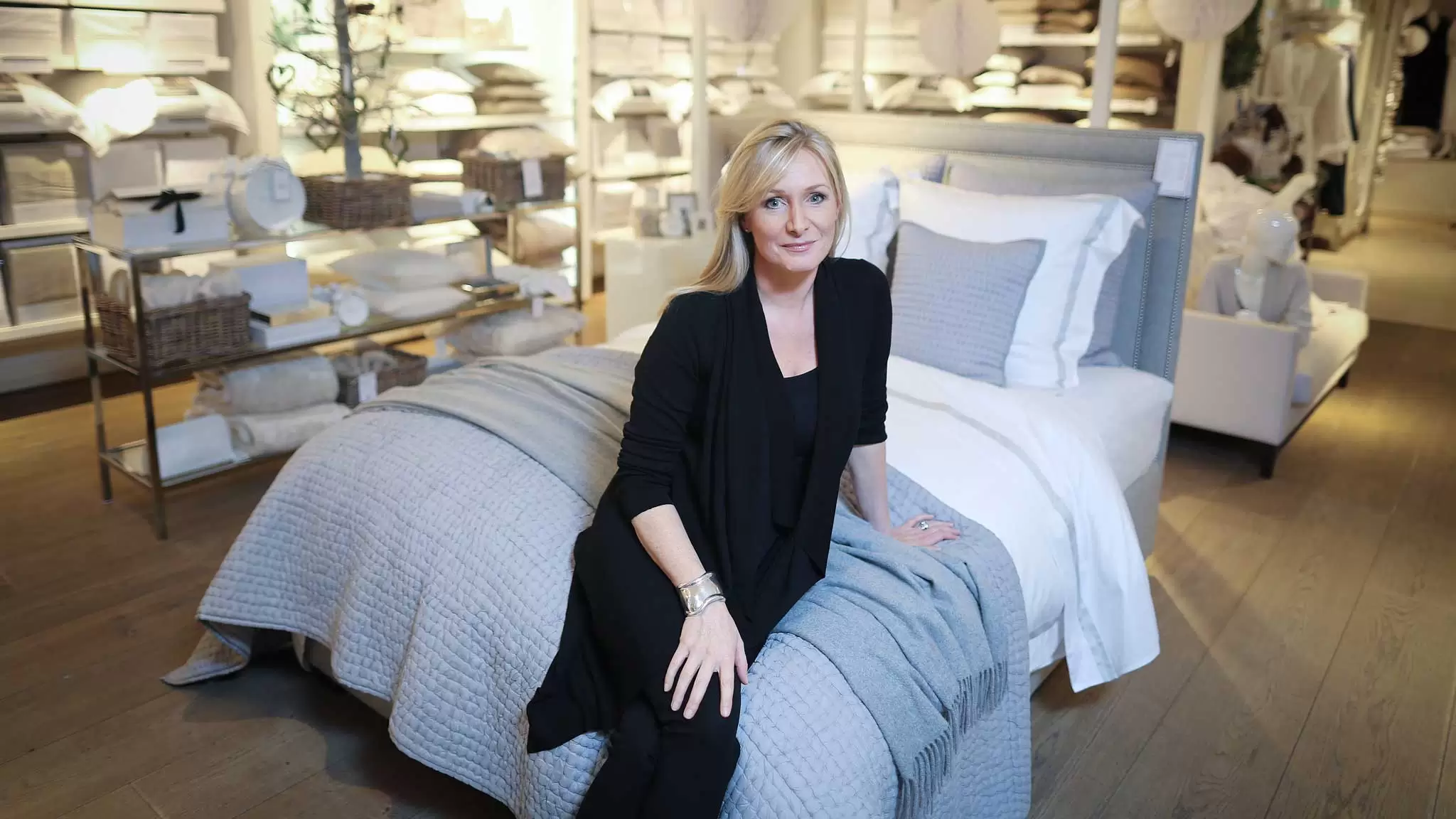 Chrissie Rucker OBE, founder of The White Company, sat in one of her stores
