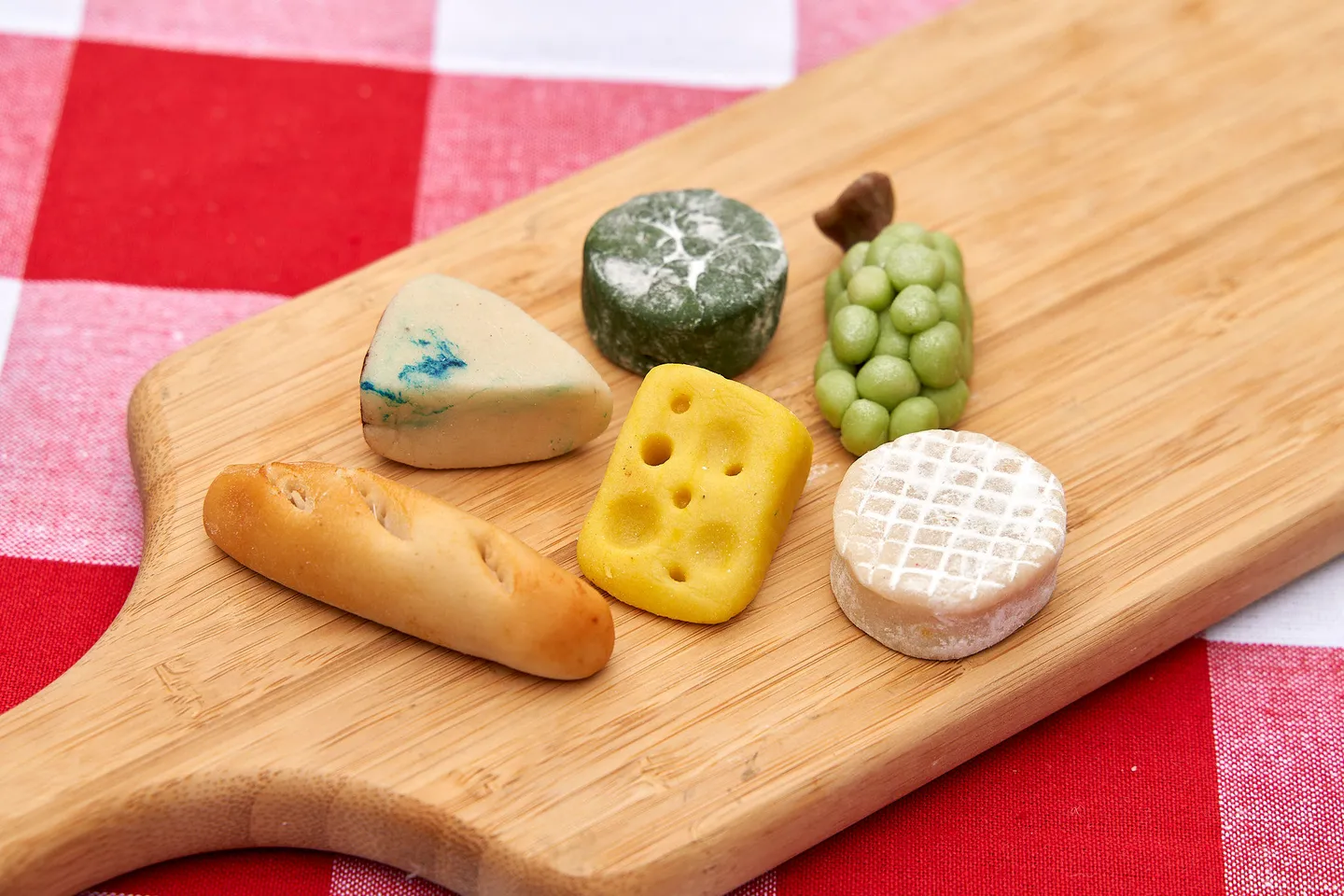 Cheese marzipan on a wooden cheese board