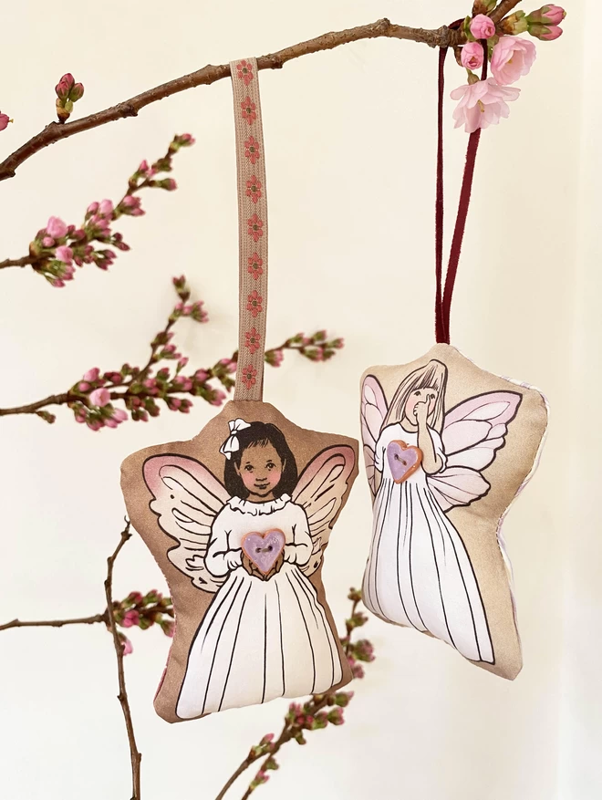 2 fairies hung on blossom branch lilac lavender