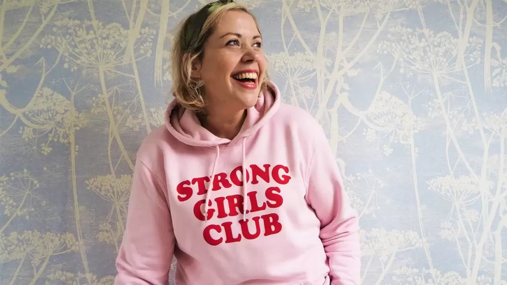 Gemma Metcalfe-Beckers, founder of Mutha.Hood, wearing a 'Strong Girls Club' hoody