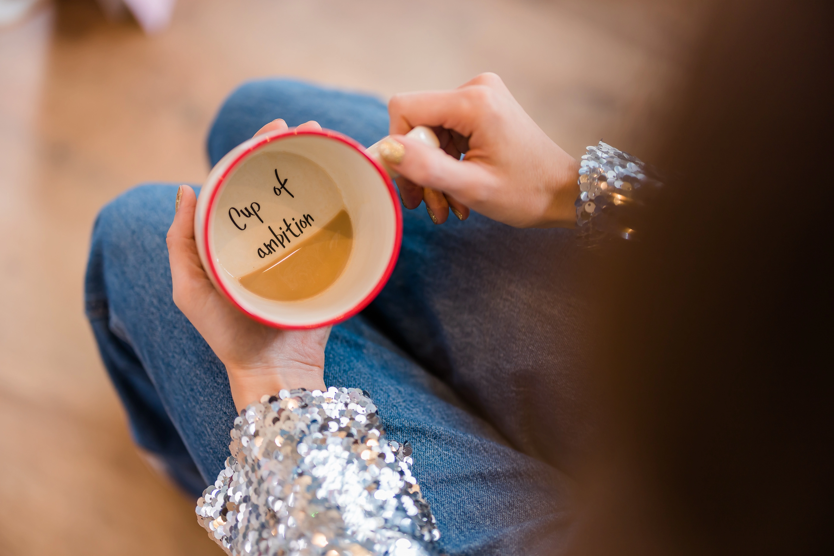 Mug that says 'cup of ambition' at the bottom