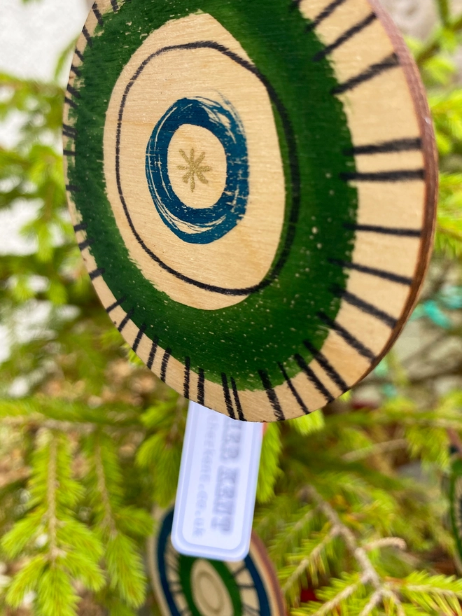 Esther Kent hand painted wooden circle decorations in blue and green