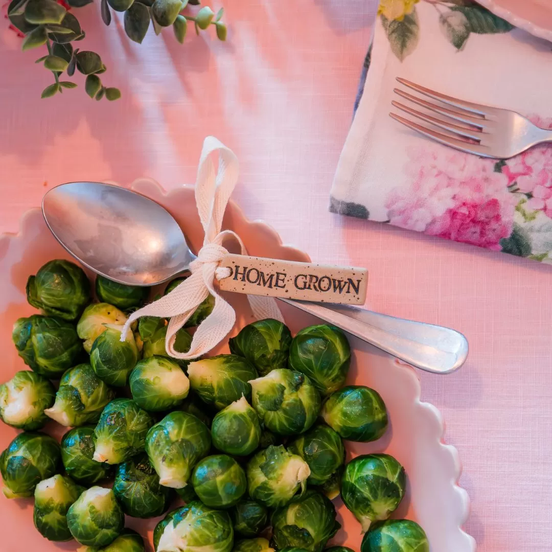 Home grown Teppi tag on a spoon with brussel sprouts