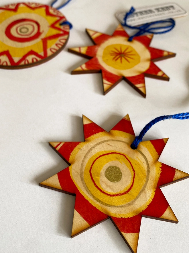 Esther Kent hand painted wooden star and circle decorations in red and yellow