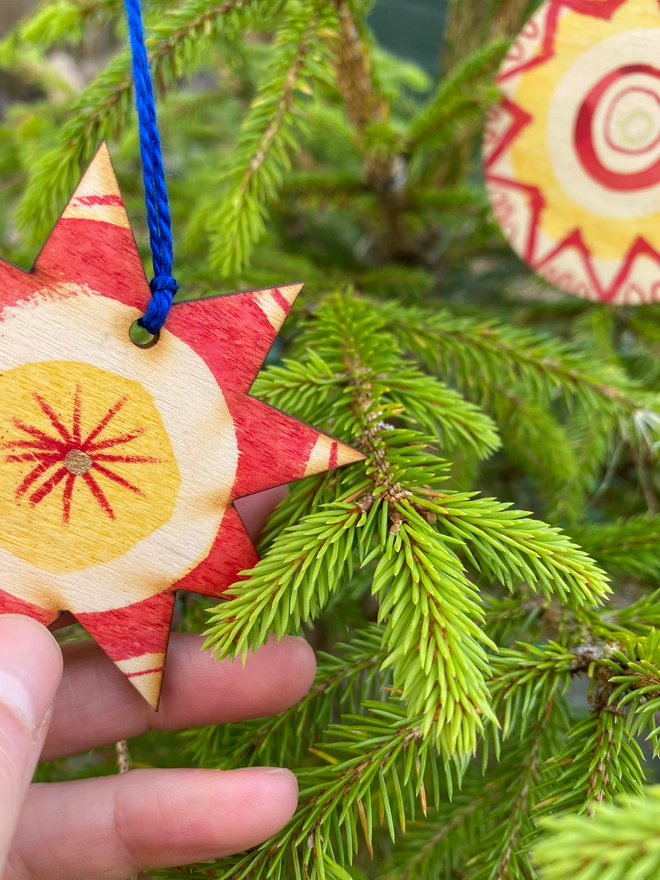 Esther Kent hand painted wooden star and circle decorations in red and yellow