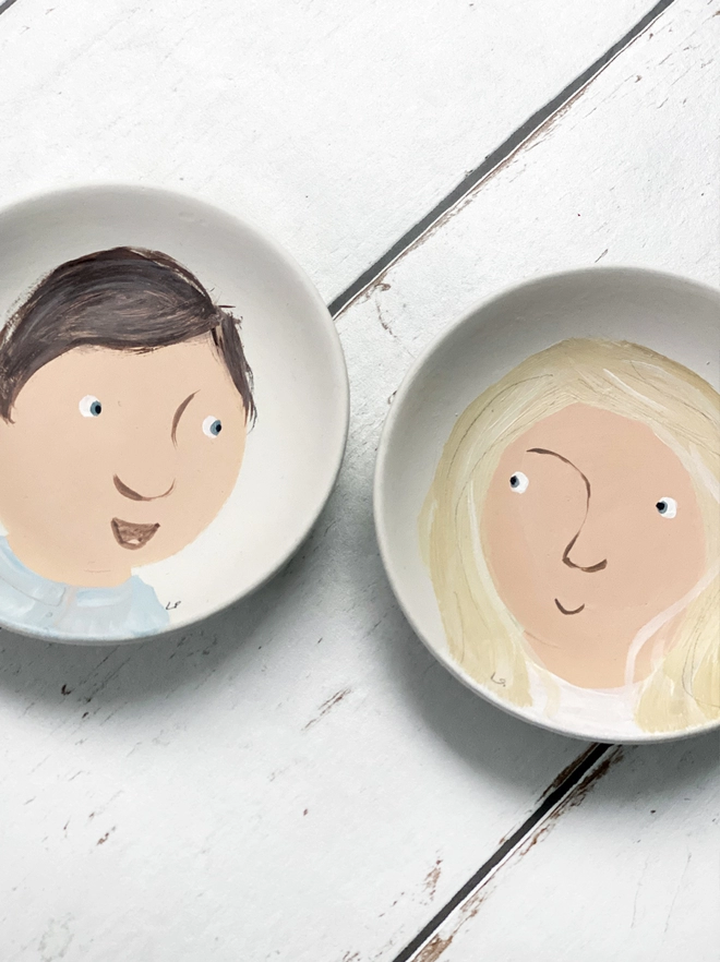 pair of plate portraits with girl and boy