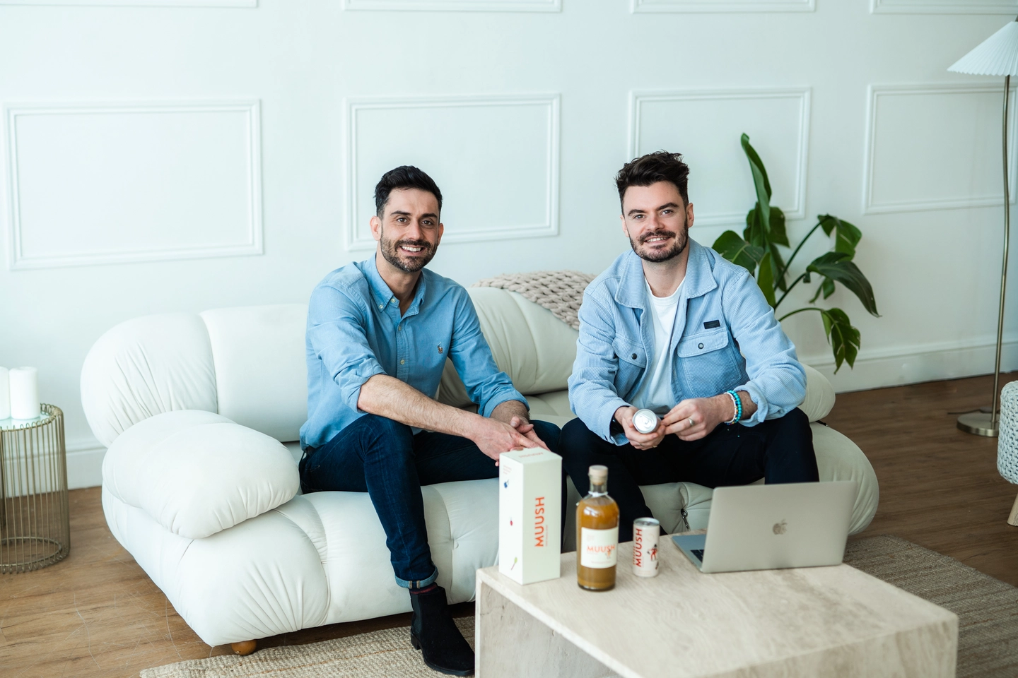Dan and Matt sitting on a white couch
