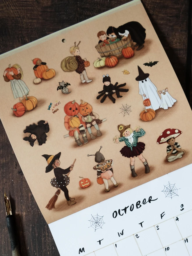 illustrated calendar open on the month of October featuring drawings of children dressed in Halloween outfits drawn in a traditional story book style