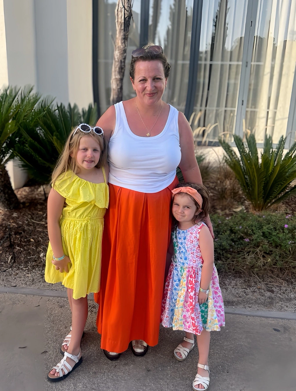 Penny Grace Knitwear Owner Helen standing with daughters Penny and Grace