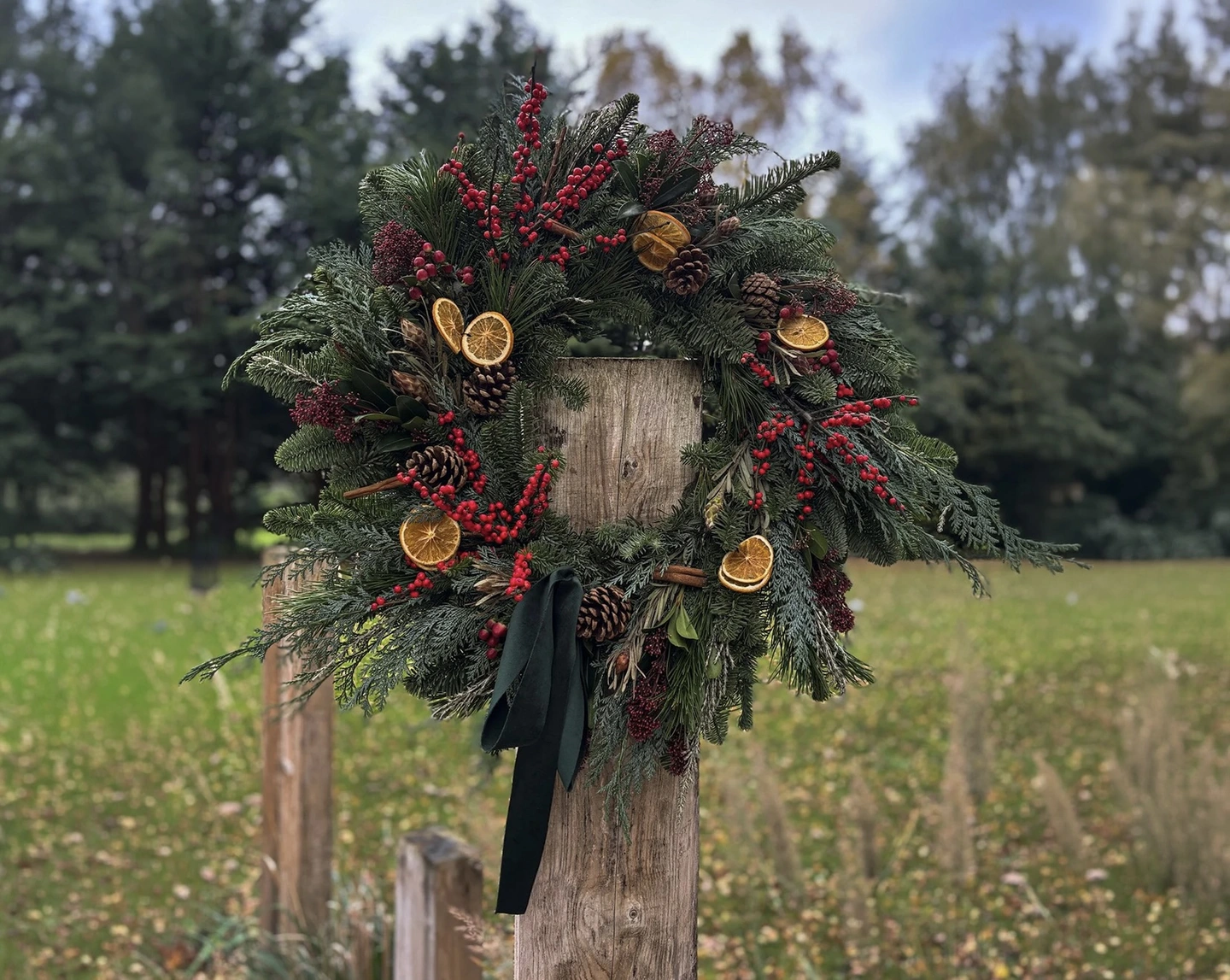 Fresh Christmas wreath on a post