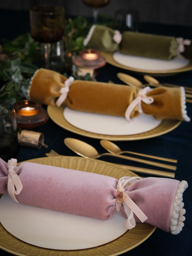 the christmas table set with velvet reusable crackers