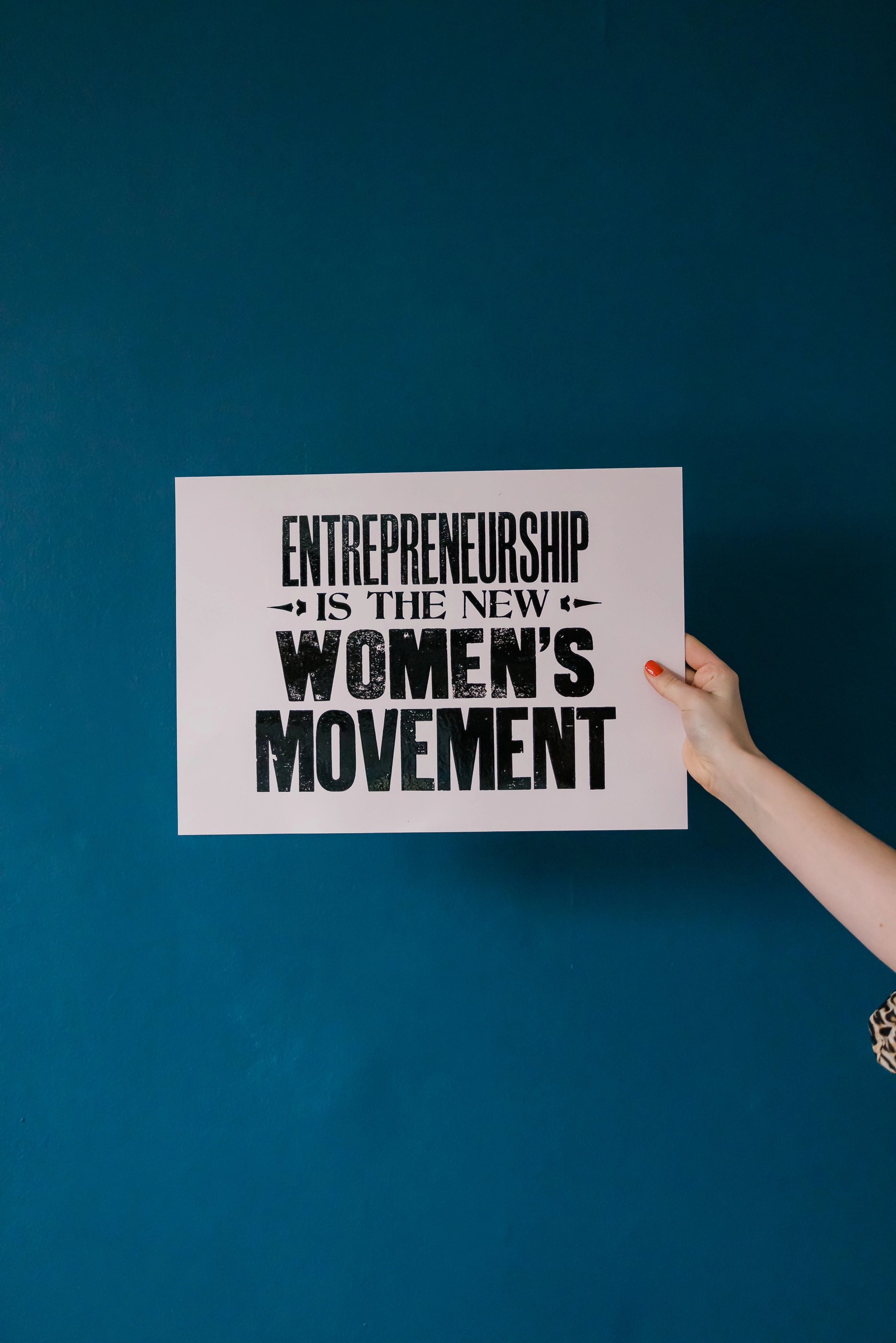 Entrepreneurship is the new women's movement print by The Small Print Company in front of a navy blue background