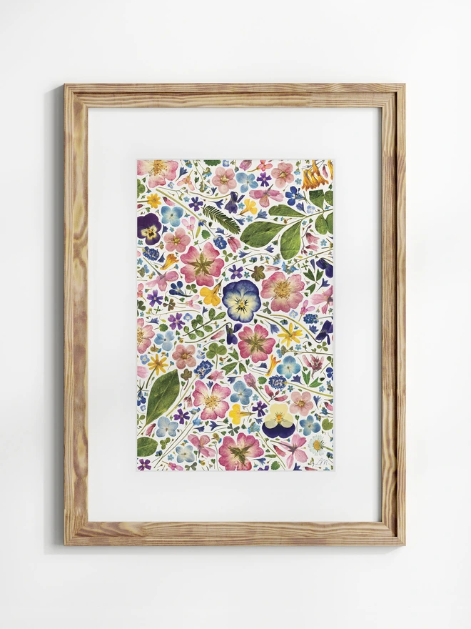 Pressed flower digital print on a light background, in a wood frame.