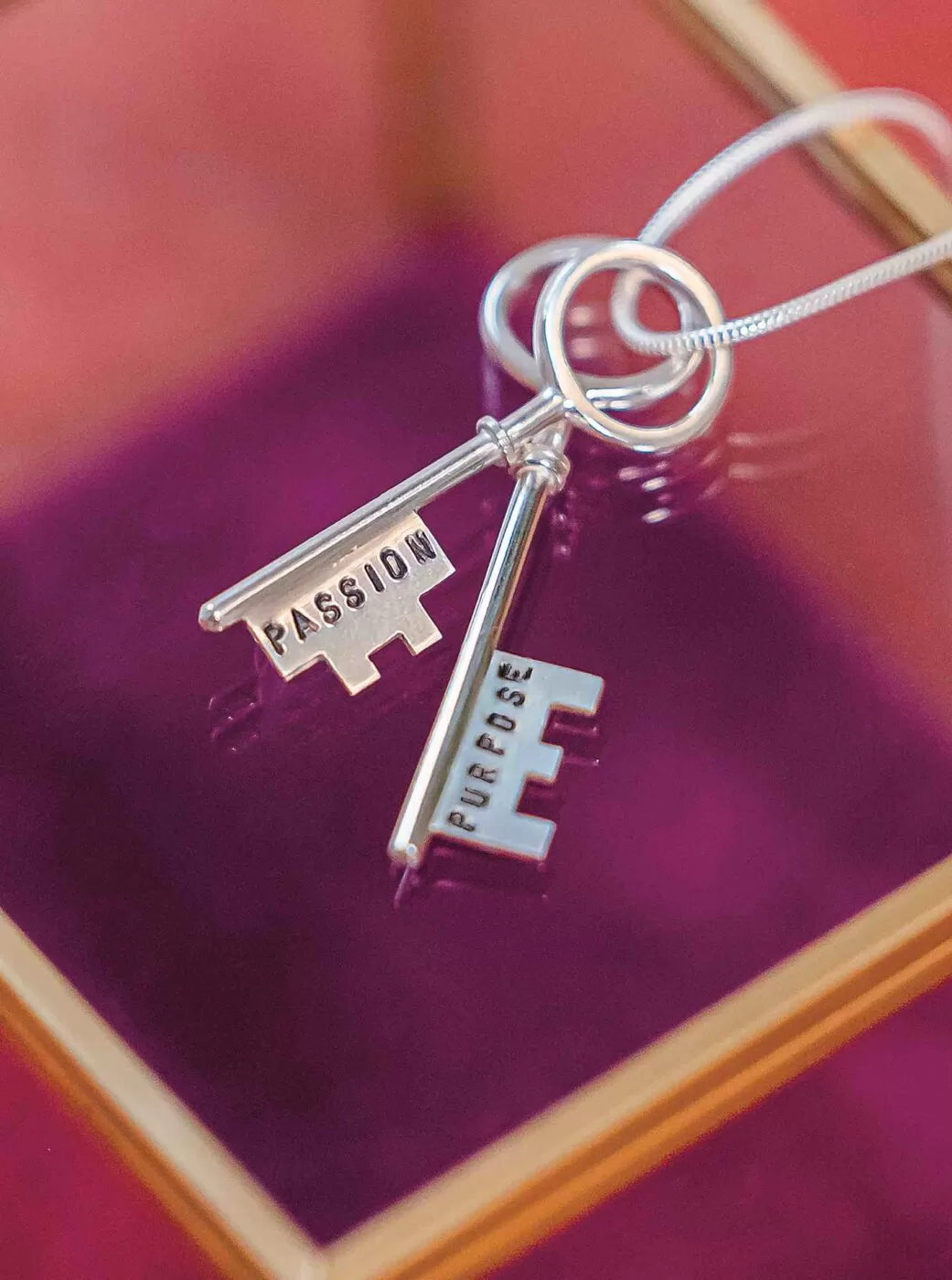 Passion and Purpose Keys on a necklace.