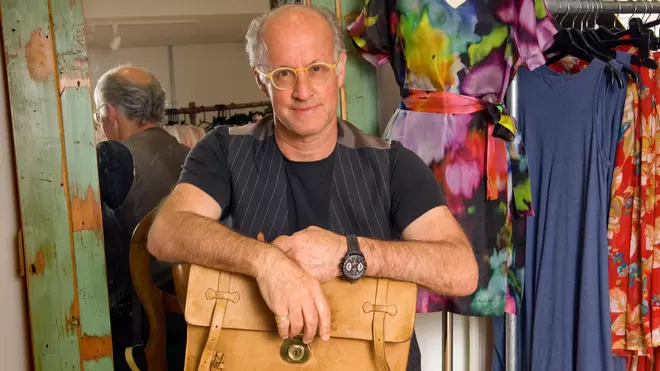 Roger Saul, founder of Mulberry, with a Mulberry bag
