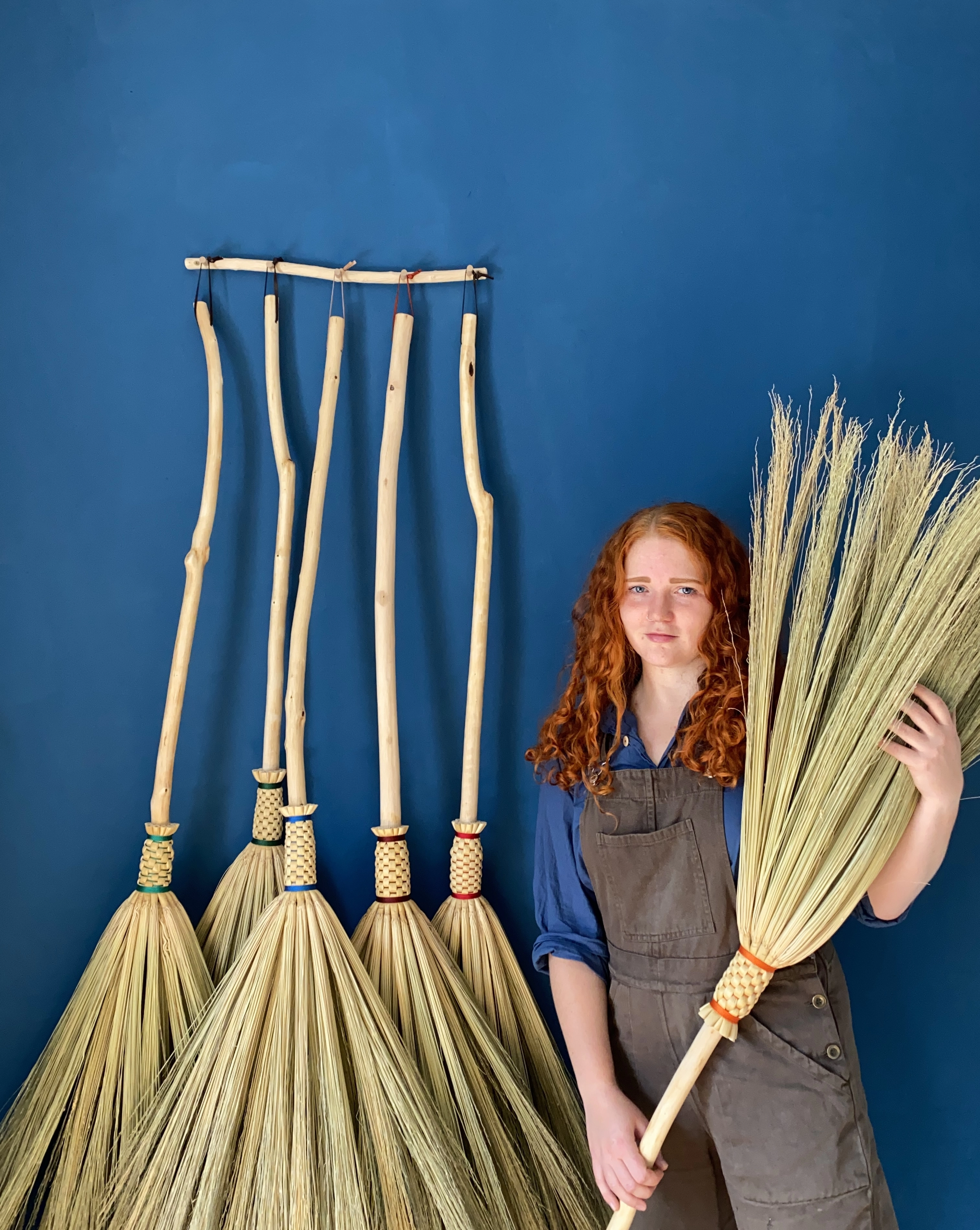 Rosa Harradine with some unfinished brooms