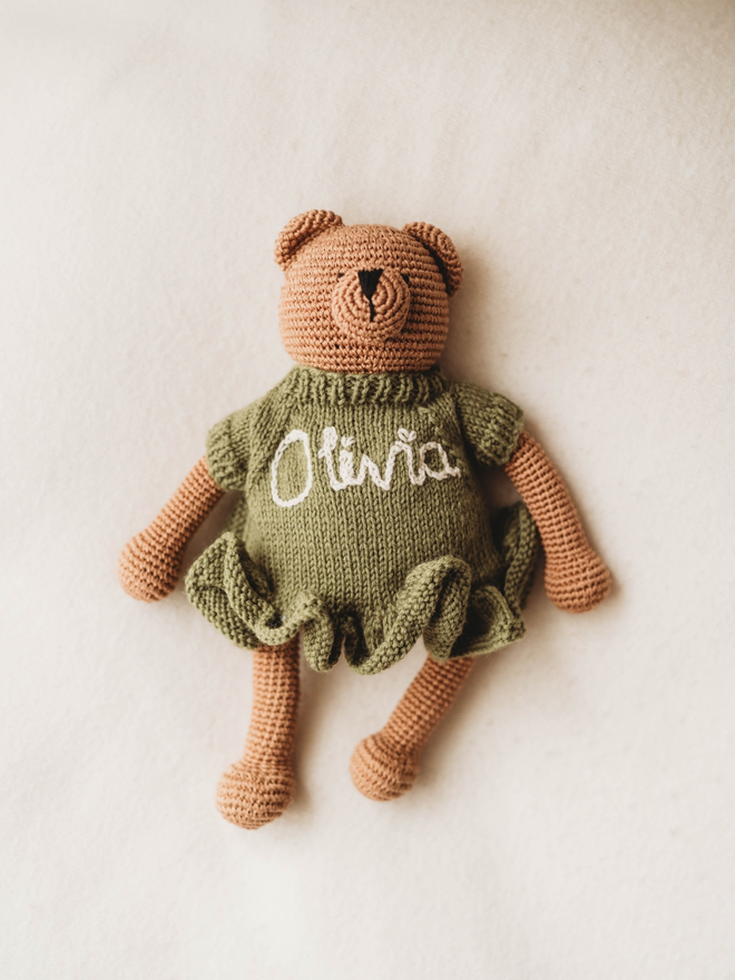 hand crochet brown teddy bear wearing olive green hand knit dress