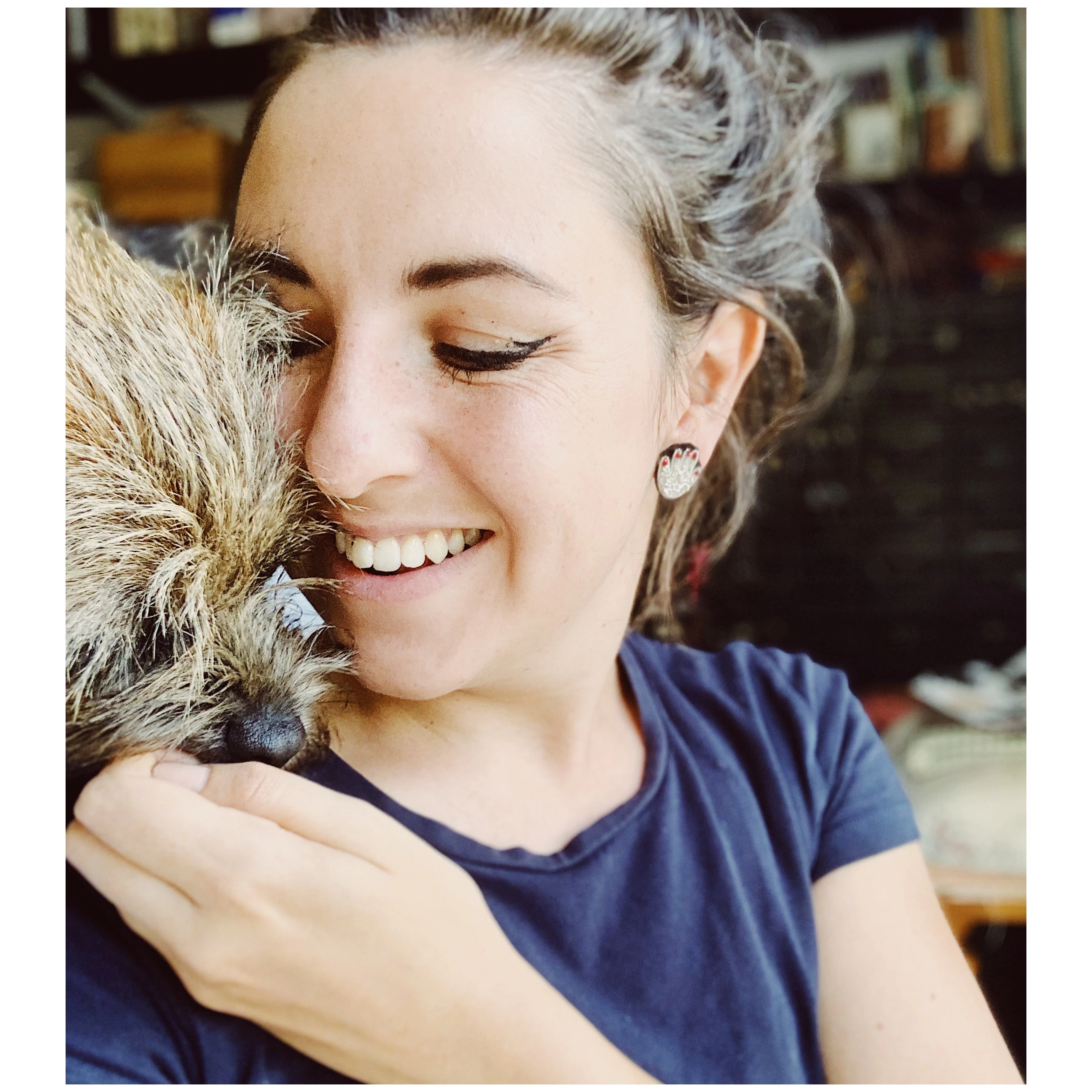 Hattie McGill in her studio with her dog