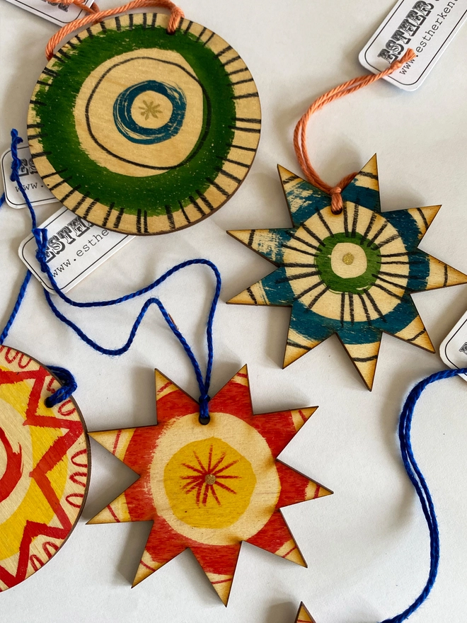 Esther Kent hand painted wooden star and circle decorations in red and yellow, blue and green