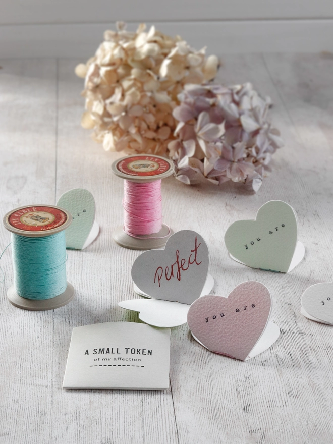 mini heart shaped books with thread and flowers