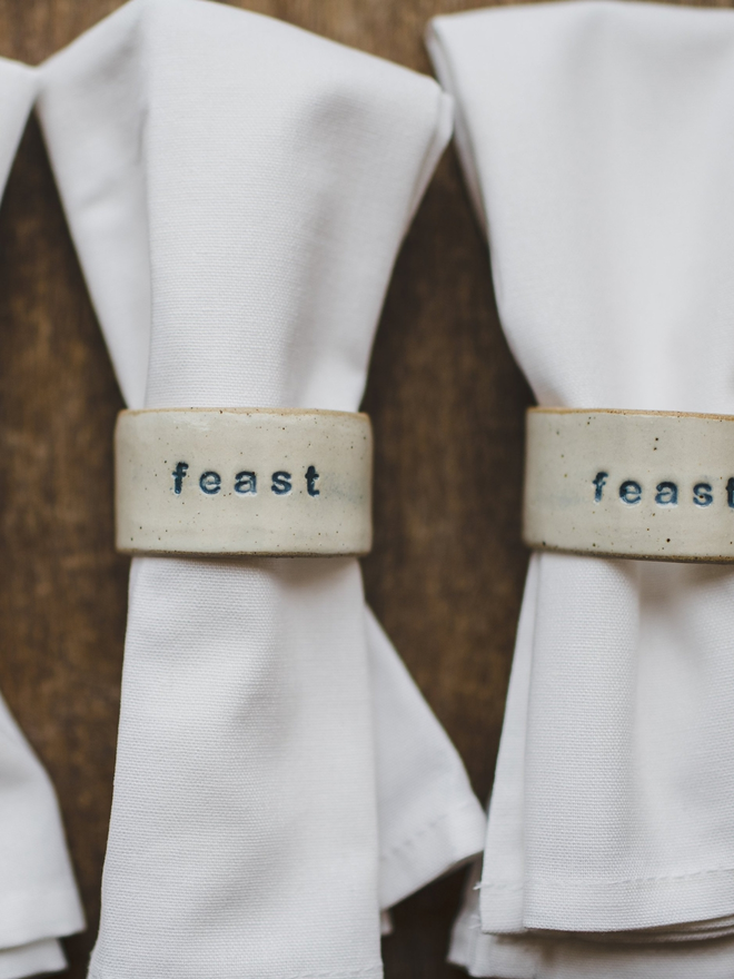 feast napkin ring on white napkin