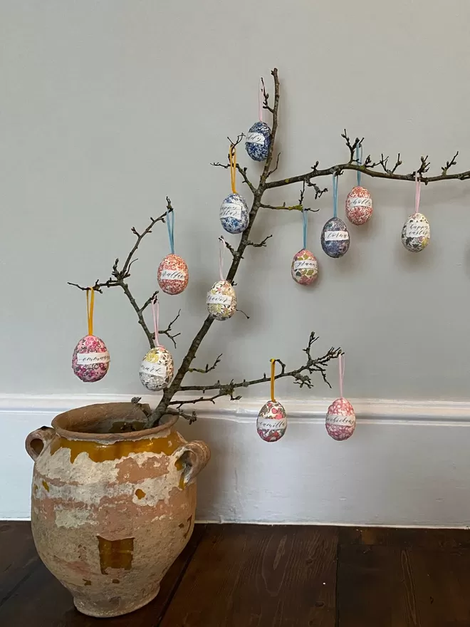 Personalised Liberty fabric decorative eggs hanging on a branch
