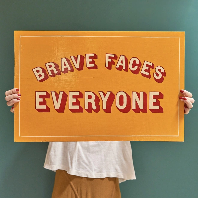 Brave faces everyone sign painting