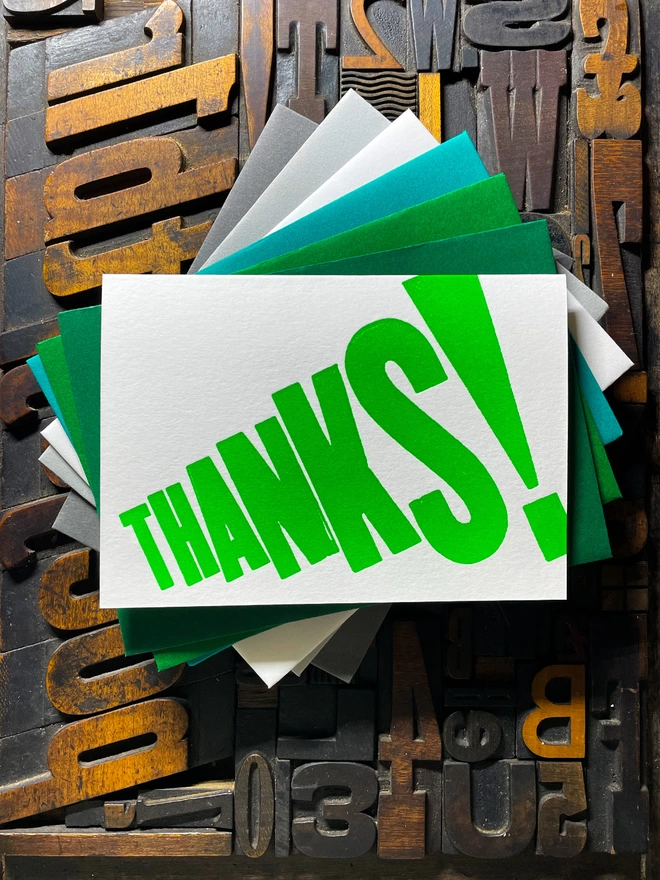 Thanks! A vibrant thank you typographic letterpress card with deep impression print using fluorescent green, with a range of colourful envelopes. Slight print variations adding to the style anding to the charm of this handmade greeting card.